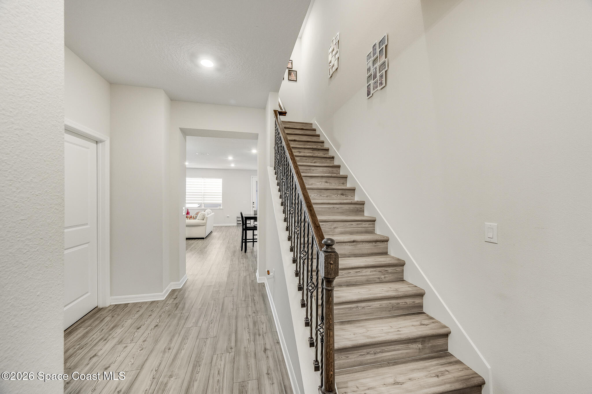 2202 Gopher Tortoise Terrace Oakland, FL 34787 - Photo 17 of 42 a view of entryway and hall with wooden floor