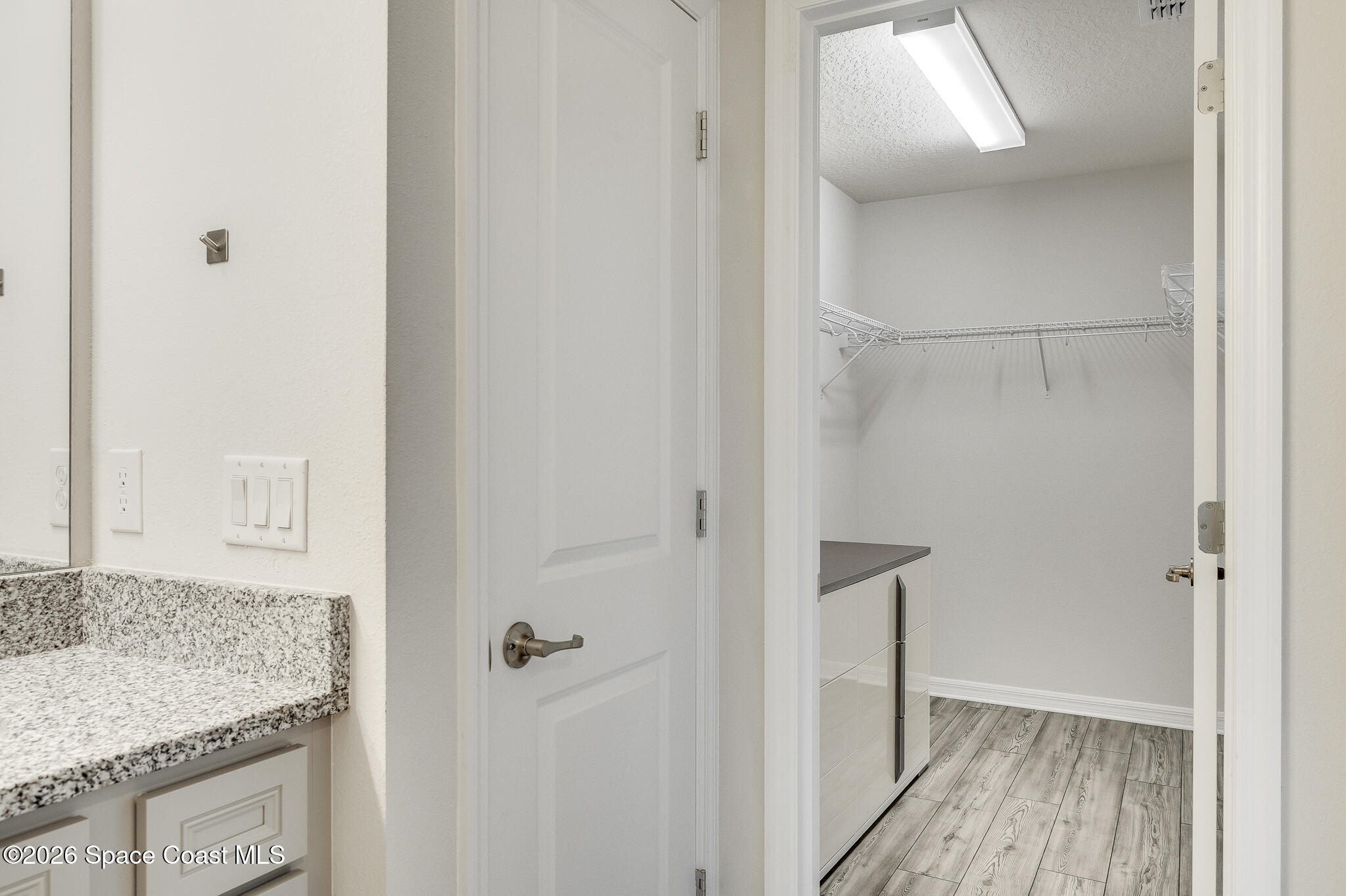 2202 Gopher Tortoise Terrace Oakland, FL 34787 - Photo 27 of 42 a bathroom with a granite countertop sink and vanity