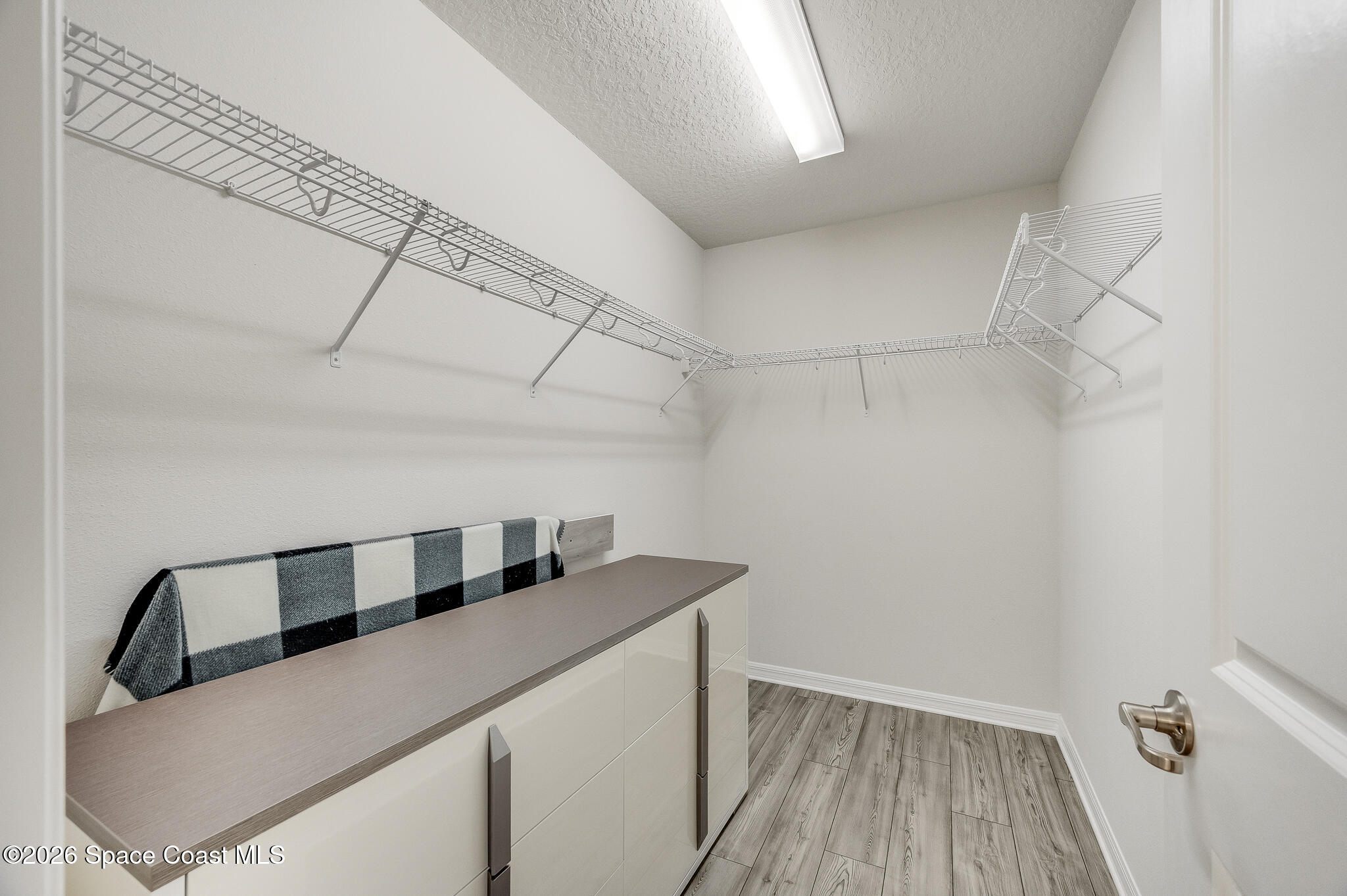 2202 Gopher Tortoise Terrace Oakland, FL 34787 - Photo 28 of 42 a kitchen that has a sink and a wooden floor