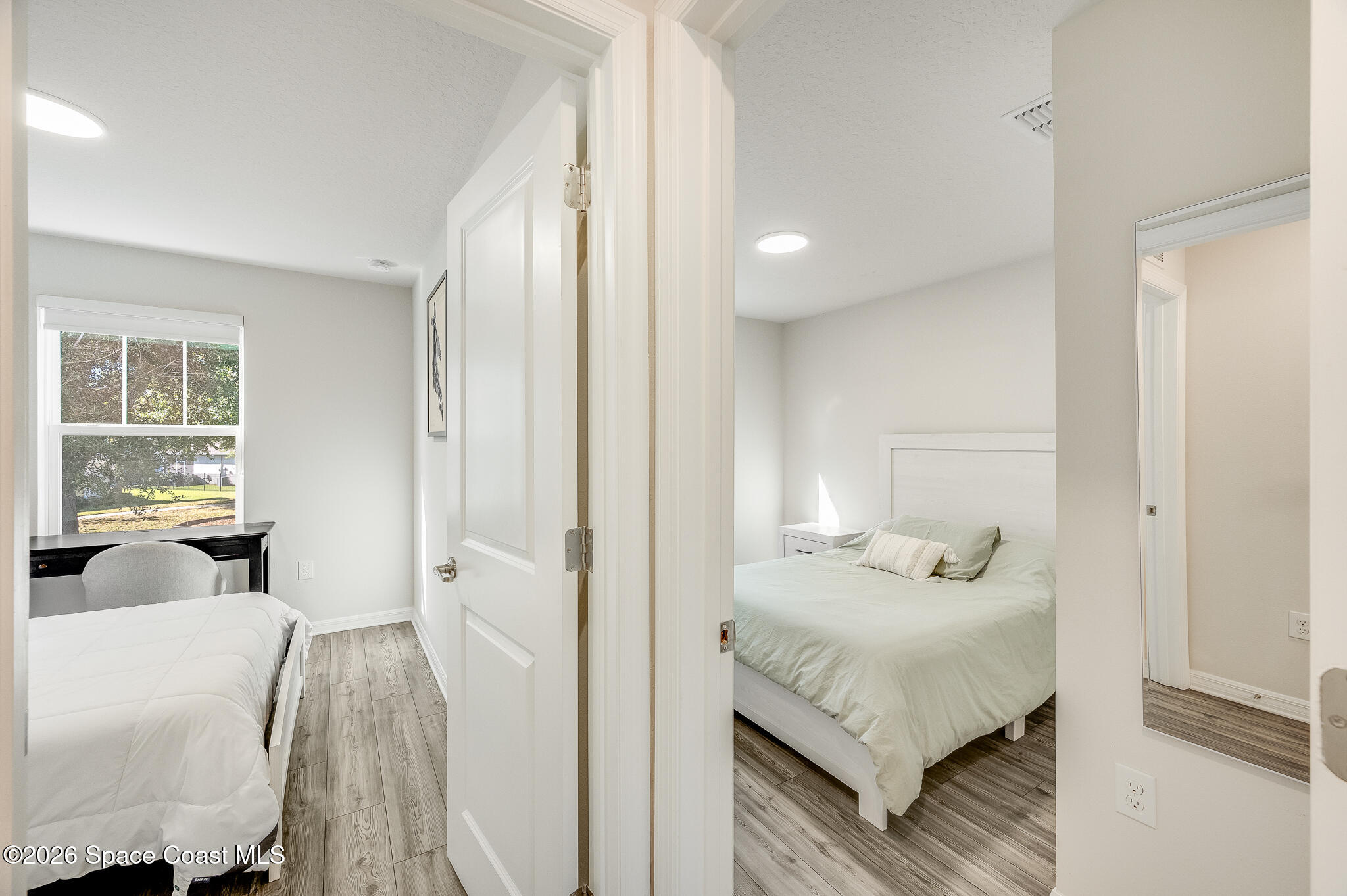 2202 Gopher Tortoise Terrace Oakland, FL 34787 - Photo 30 of 42 a bedroom with a bed and wooden floor