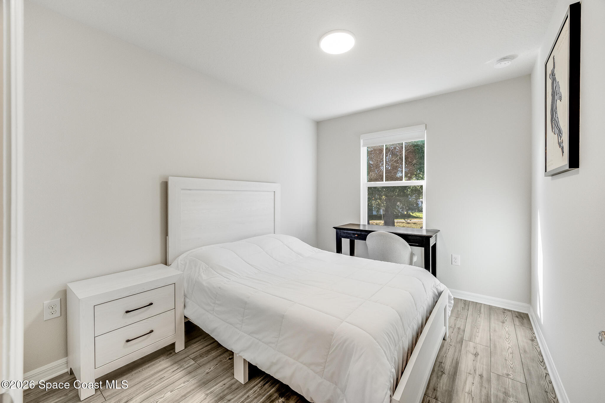 2202 Gopher Tortoise Terrace Oakland, FL 34787 - Photo 31 of 42 a bedroom with a bed and a window