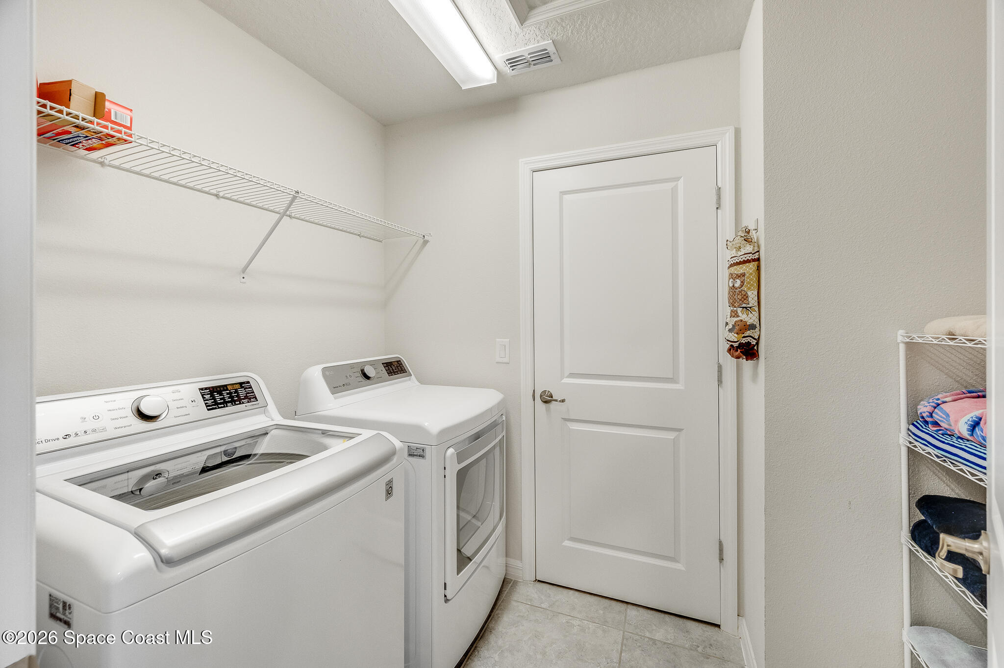 2202 Gopher Tortoise Terrace Oakland, FL 34787 - Photo 35 of 42 a utility room with dryer and washer