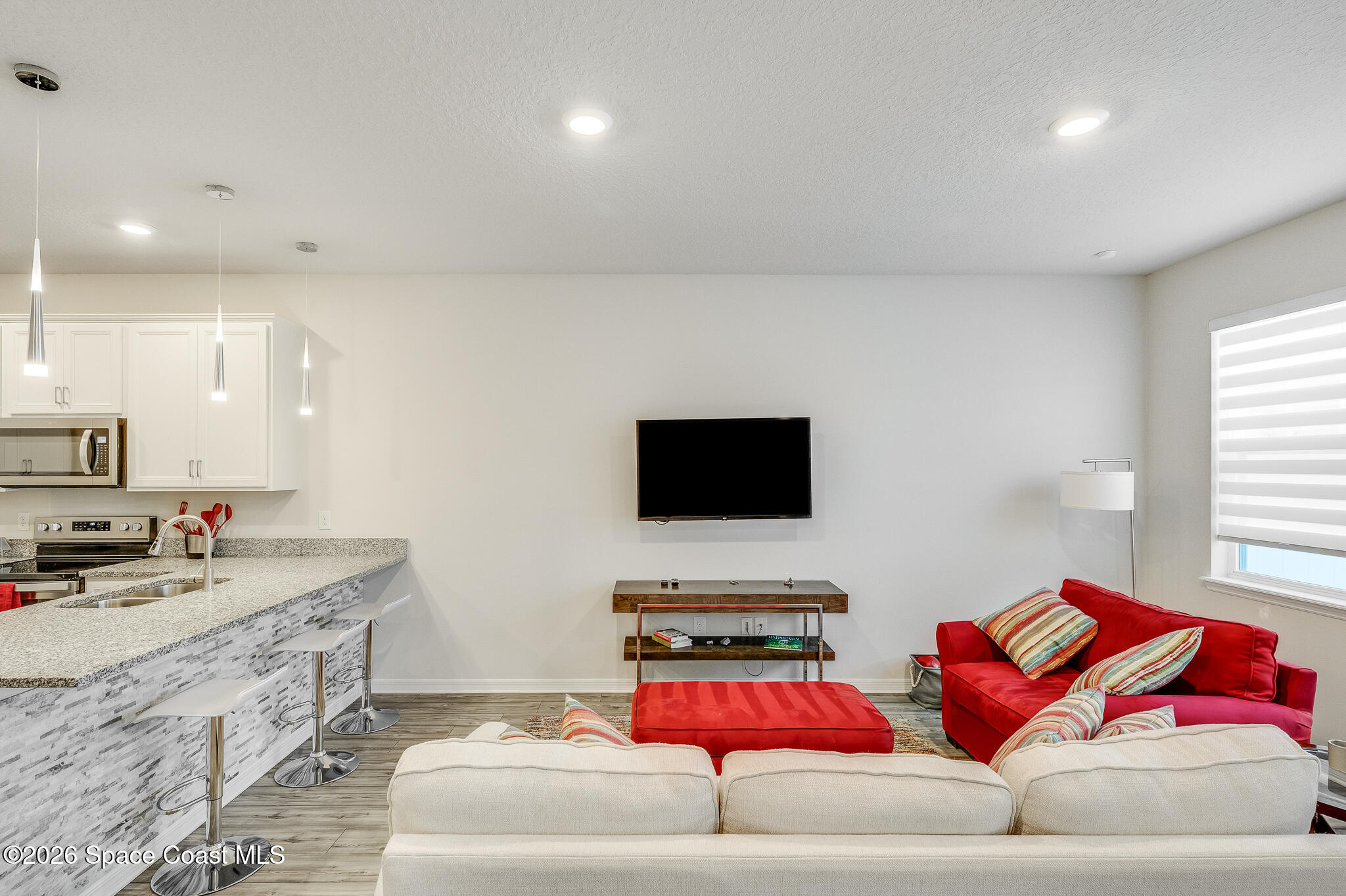 2202 Gopher Tortoise Terrace Oakland, FL 34787 - Photo 6 of 42 a living room with furniture and a flat screen tv