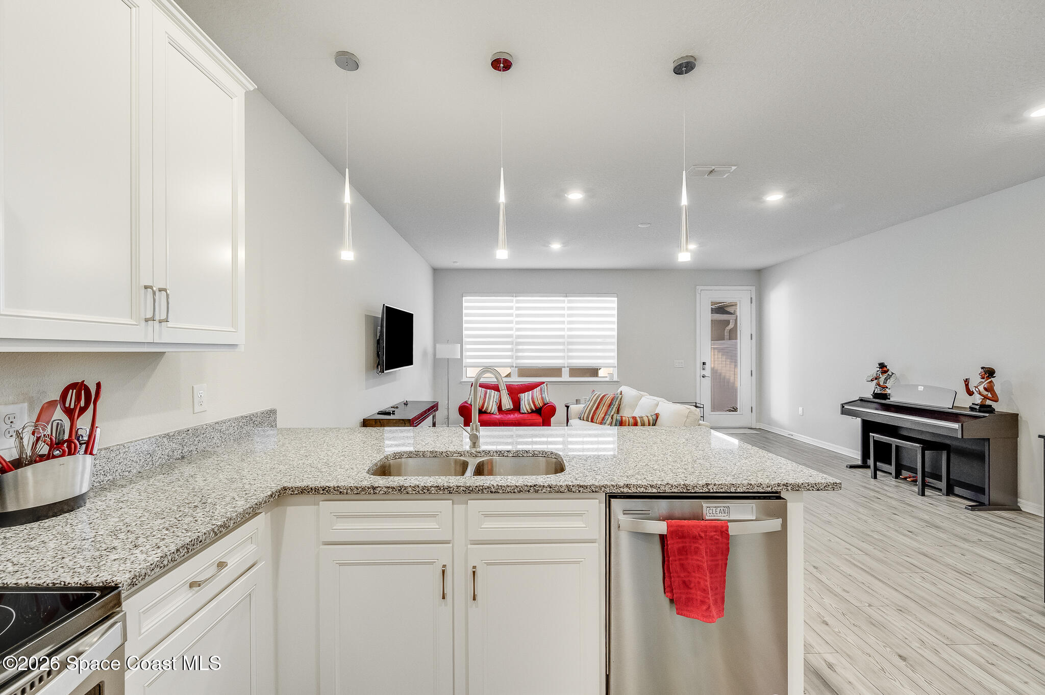 2202 Gopher Tortoise Terrace Oakland, FL 34787 - Photo 9 of 42 a kitchen with sink and view living room