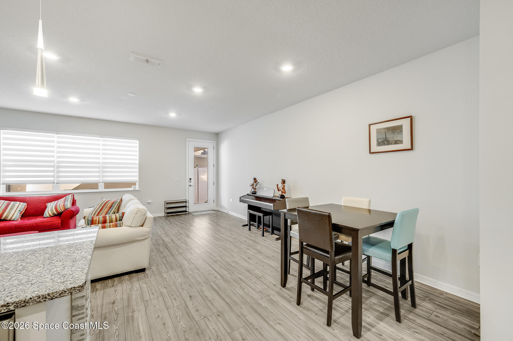 2202 Gopher Tortoise Terrace Oakland, FL 34787 - Photo 10 of 42 a living room with furniture and a wooden floor