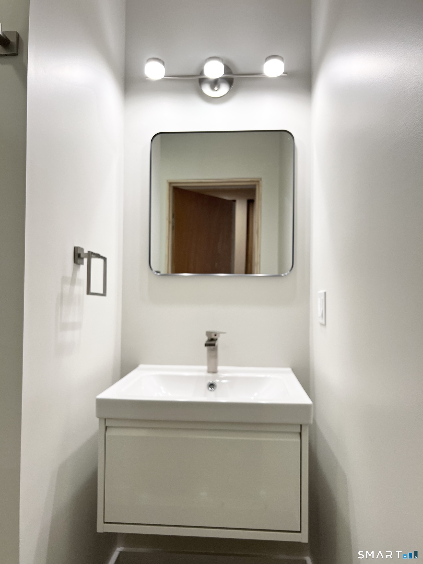 179 Butternut Street, Unit 6 Middletown, CT 06457 - Photo 17 of 34 a bathroom with a sink and a mirror