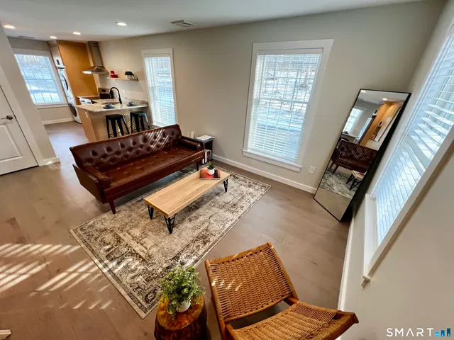 a living room with a couch and a window