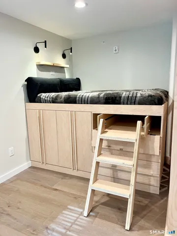 a kitchen with a refrigerator and cabinets