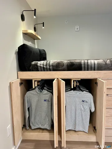 a room that has a bed and a table in it