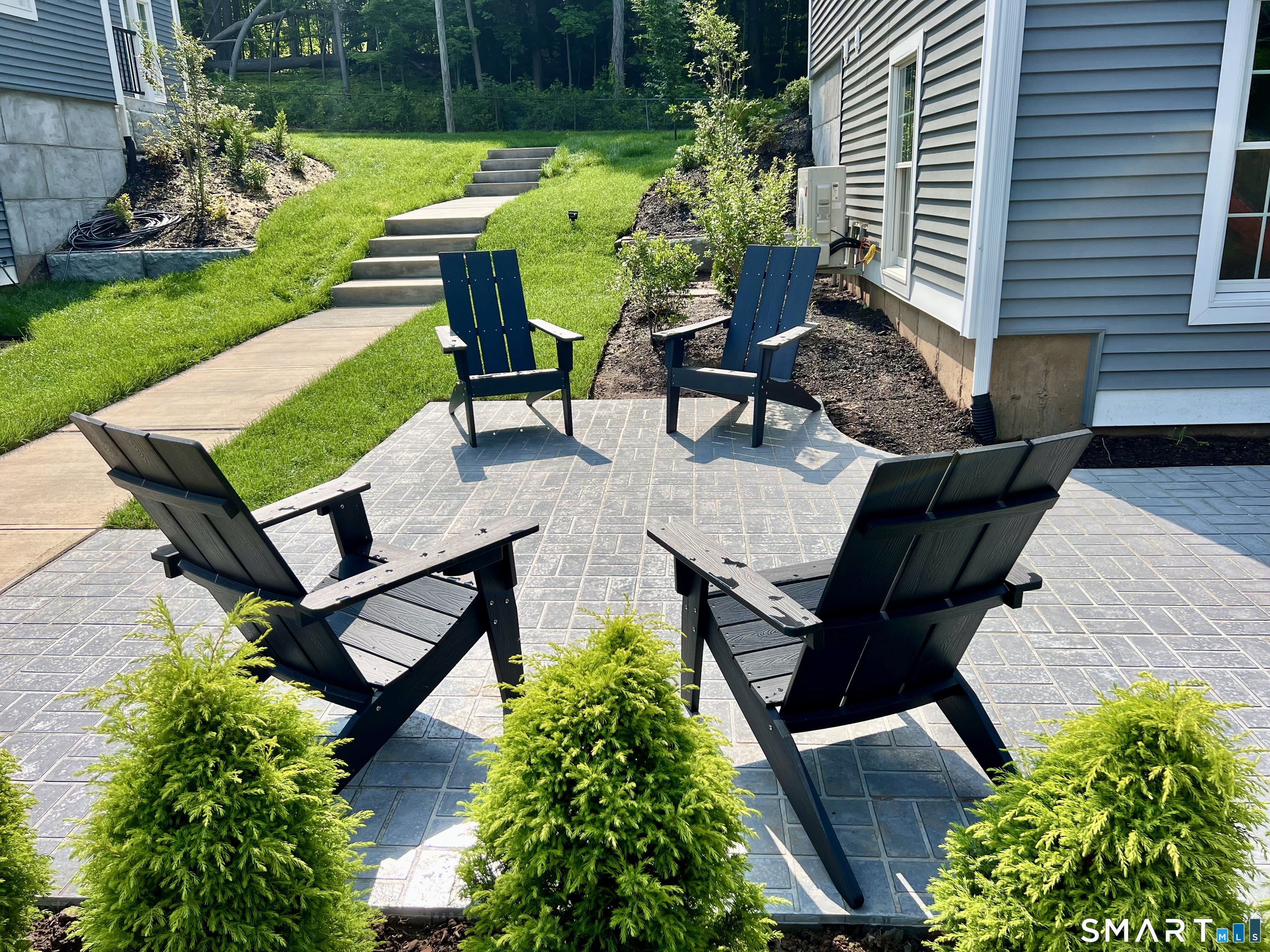 179 Butternut Street, Unit 6 Middletown, CT 06457 - Photo 26 of 34 an aerial view of a house with garden space and sitting area