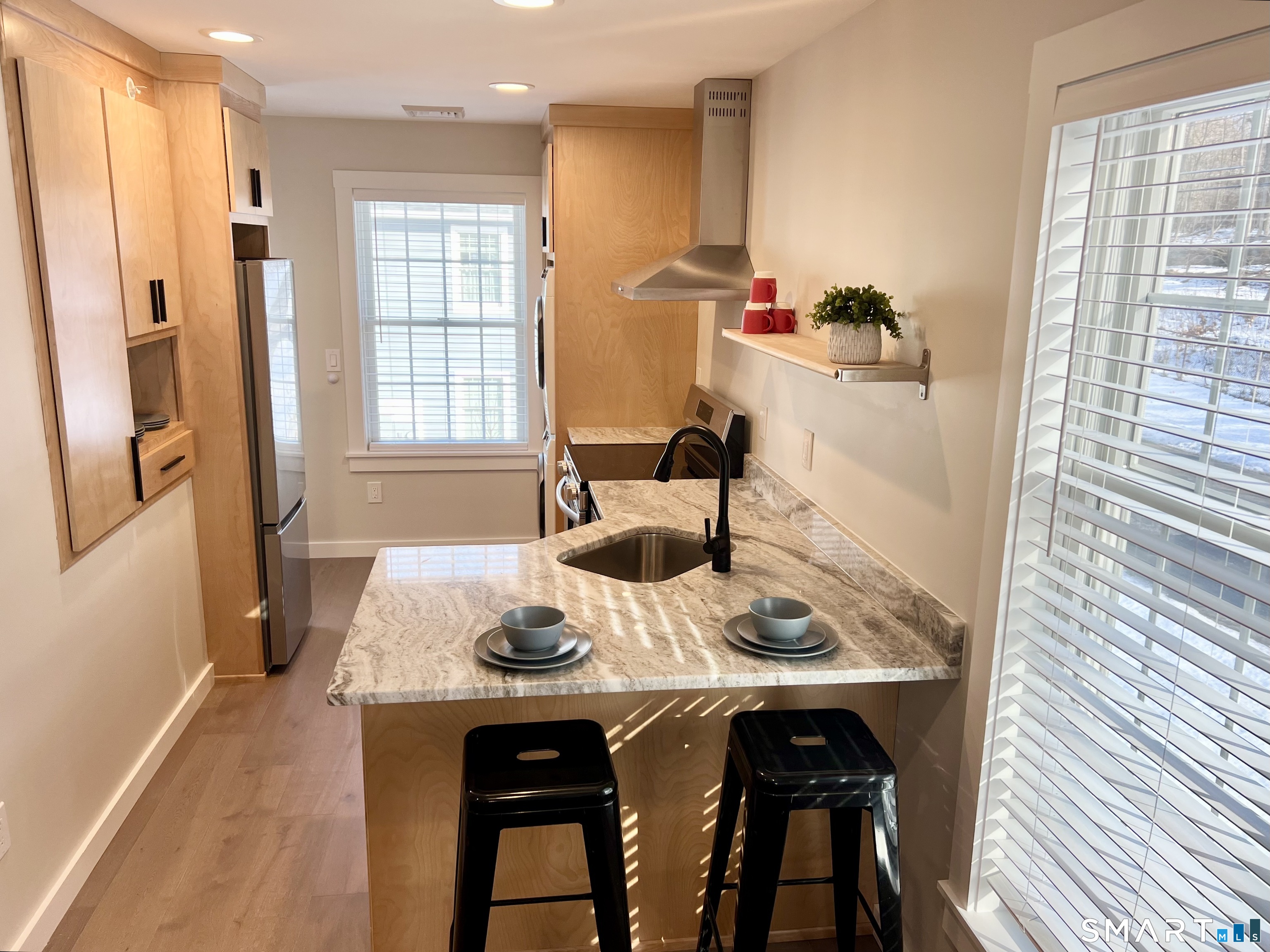 179 Butternut Street, Unit 6 Middletown, CT 06457 - Photo 4 of 34 a view of a dining room with furniture window and wooden floor