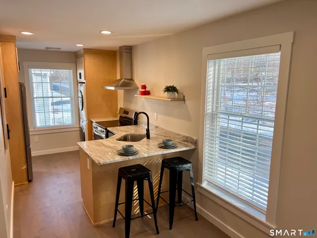 a view of a dining room with furniture and window