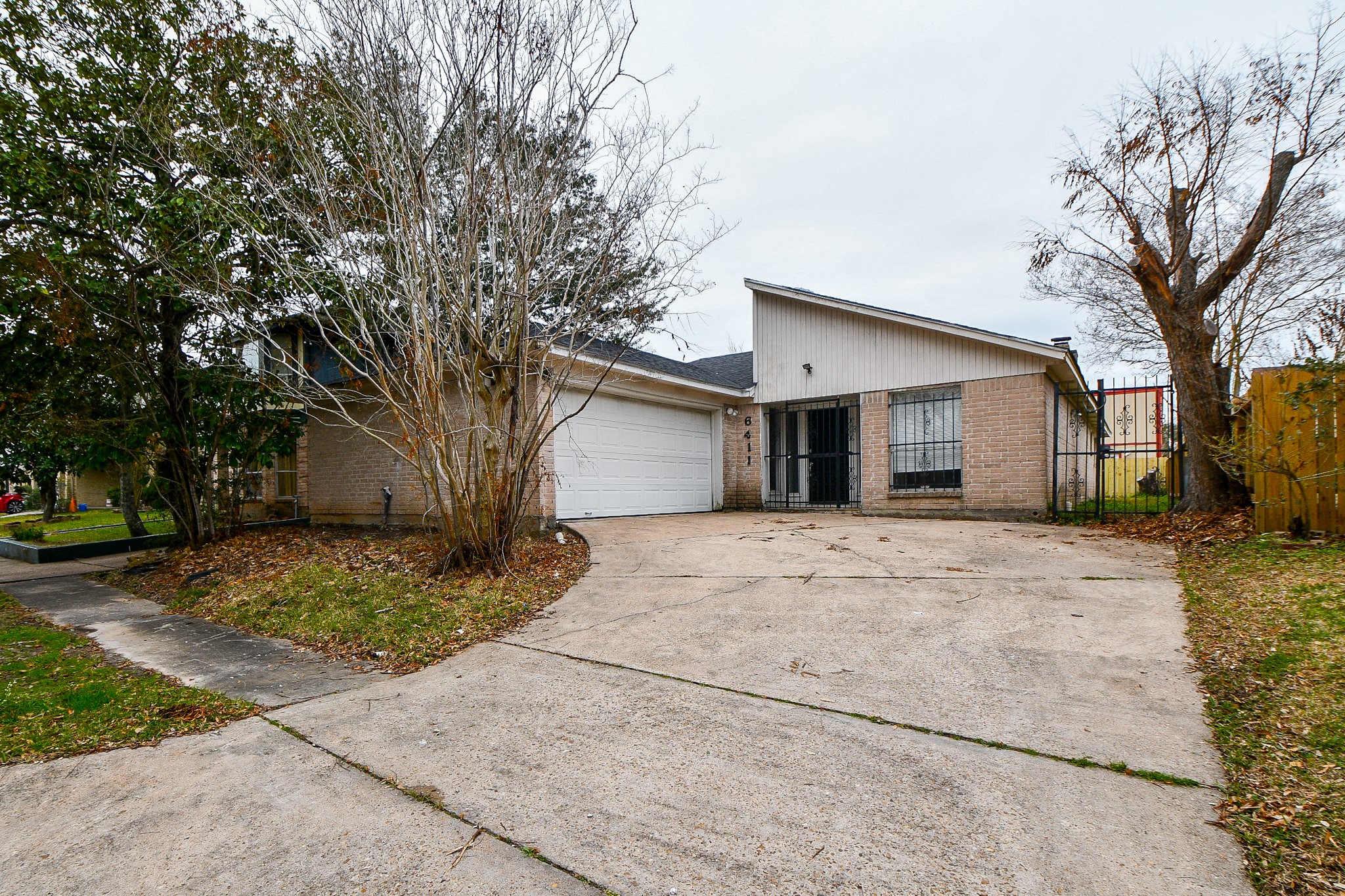 a view of a house with a yard and garage