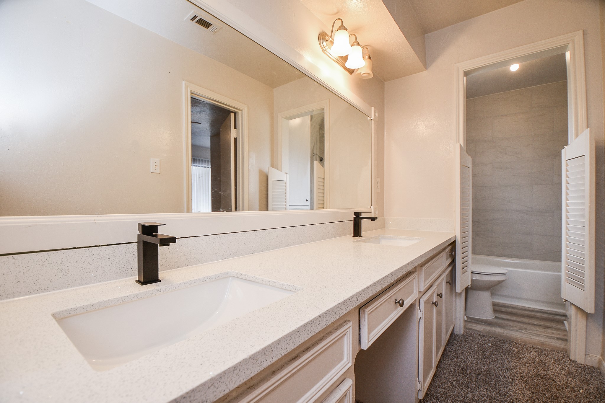6411 Teal Run Drive Houston, TX 77035 - Photo 30 of 32 a bathroom with a sink a toilet a mirror and shower