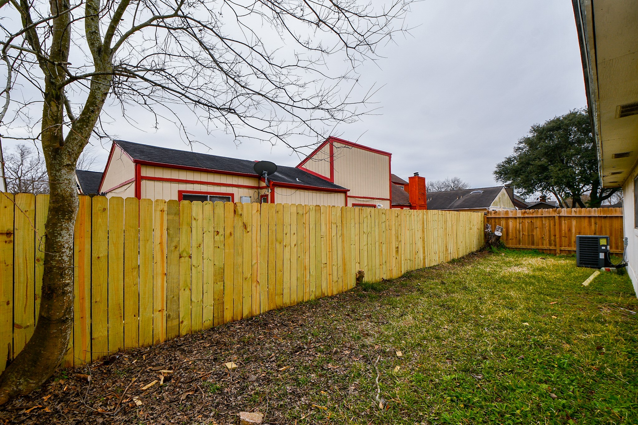 6411 Teal Run Drive Houston, TX 77035 - Photo 32 of 32 a backyard of a house with lots of green space