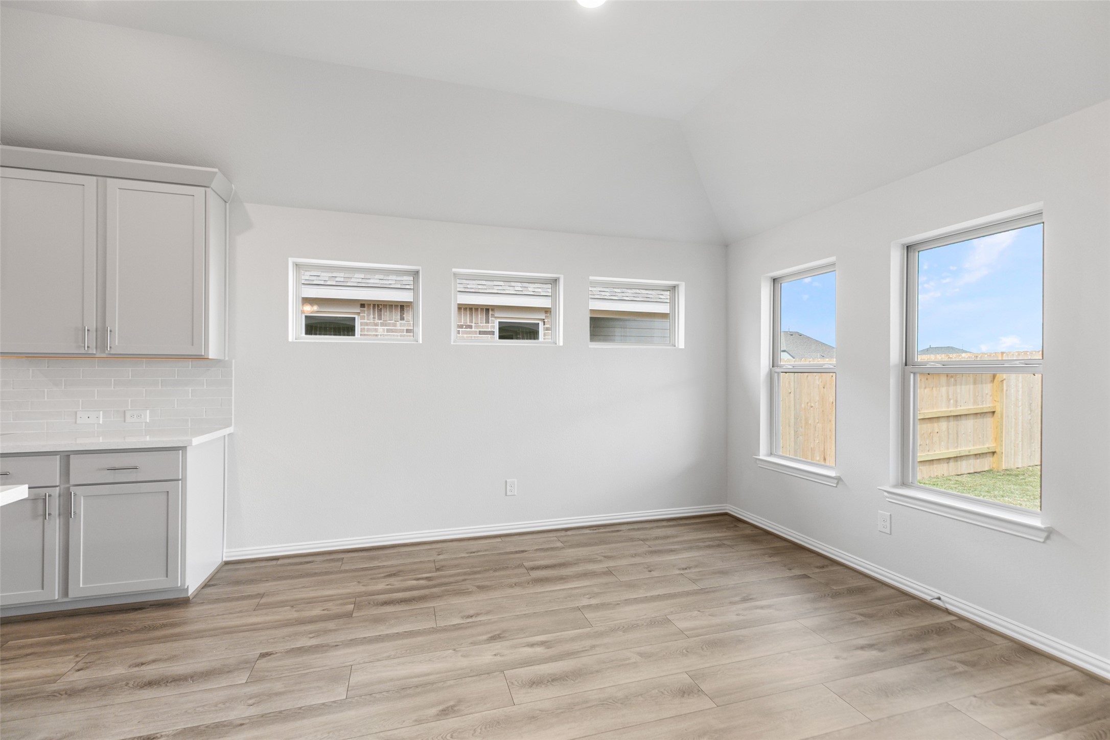 803 Evergreen Frst Lane Rosharon, TX 77583 - Photo 21 of 31 a view of an empty room with a window and wooden floor