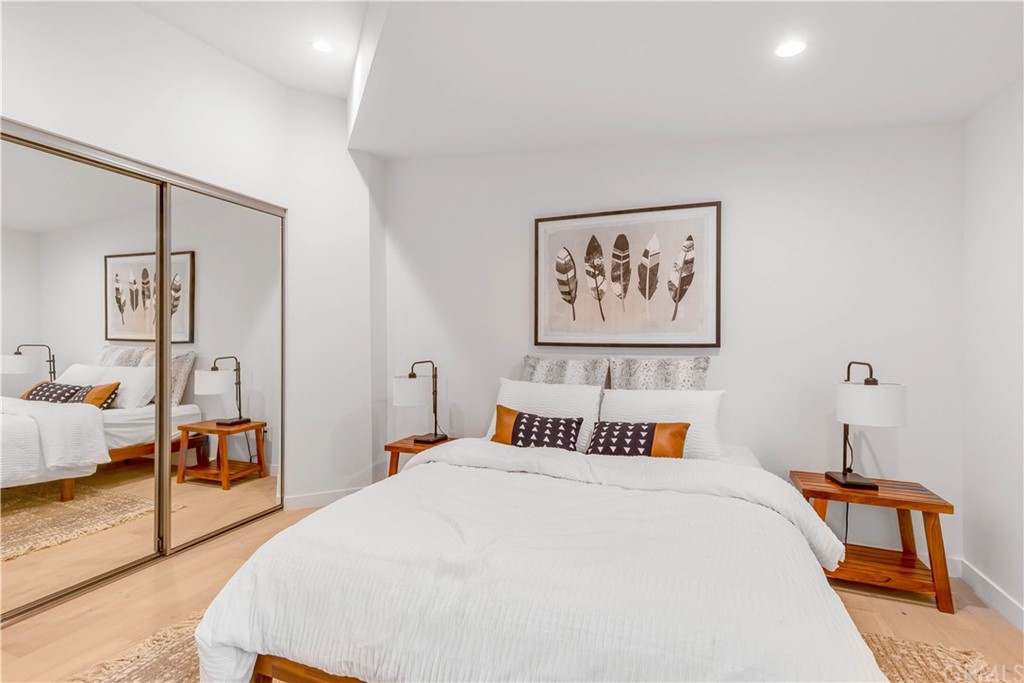 832 Mountain View Street Altadena, CA 91001 - Photo 17 of 39 a bedroom with a bed and a large mirror