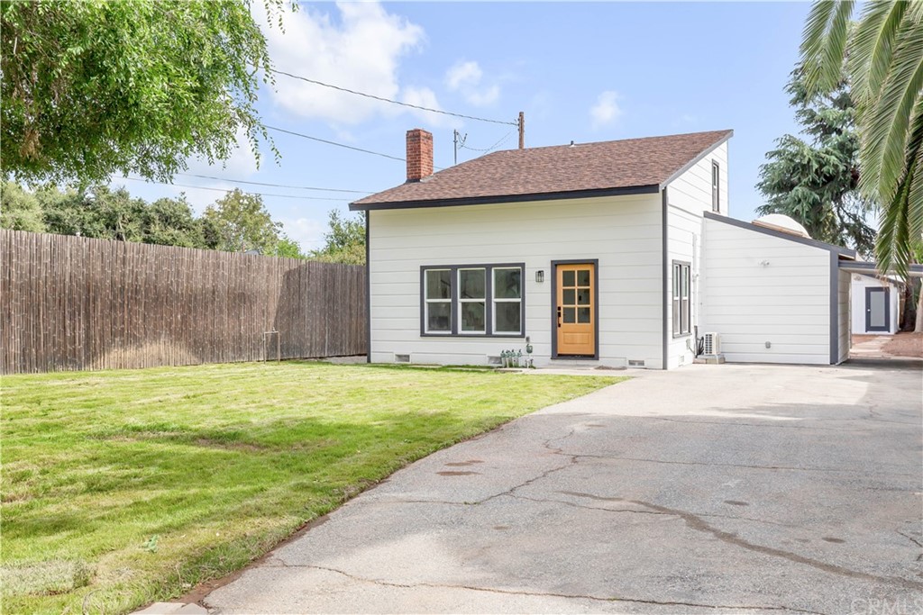 832 Mountain View Street Altadena, CA 91001 - Photo 24 of 39 a front view of a house with a garden and garage