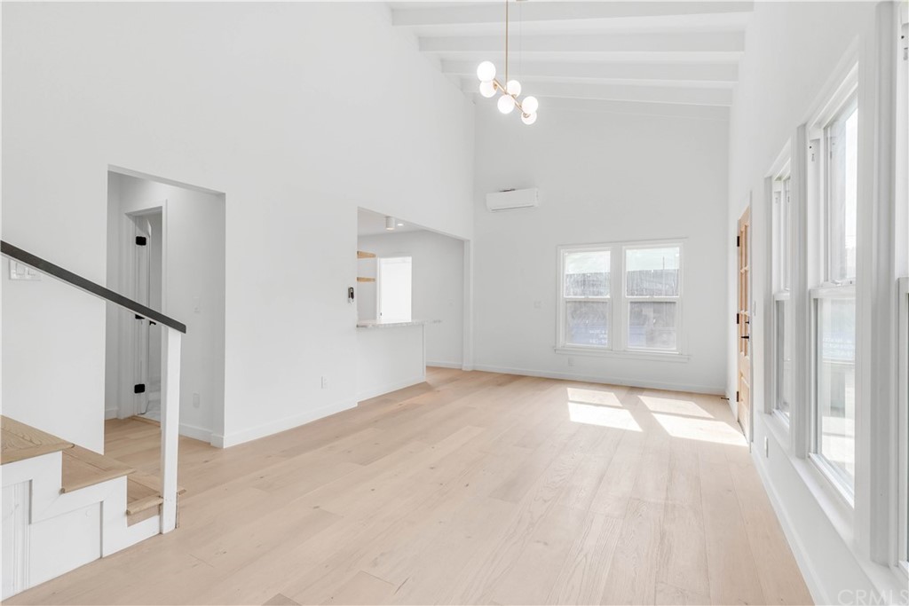 832 Mountain View Street Altadena, CA 91001 - Photo 26 of 39 an empty room with chandelier fan and windows
