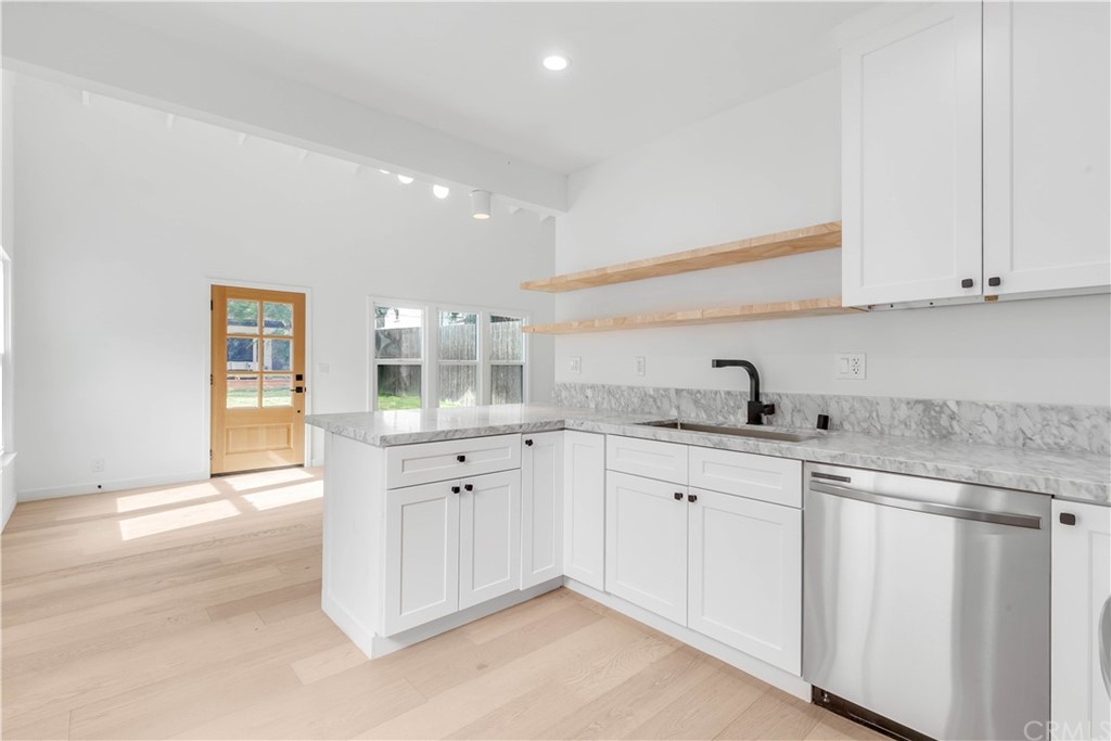 832 Mountain View Street Altadena, CA 91001 - Photo 30 of 39 a kitchen with white cabinets
