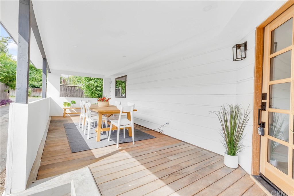 832 Mountain View Street Altadena, CA 91001 - Photo 6 of 39 a dining room with furniture wooden floor and a rug