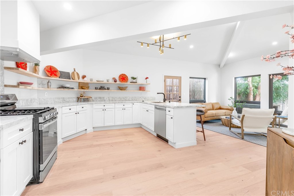 832 Mountain View Street Altadena, CA 91001 - Photo 8 of 39 a large white kitchen with cabinets a sink and appliances
