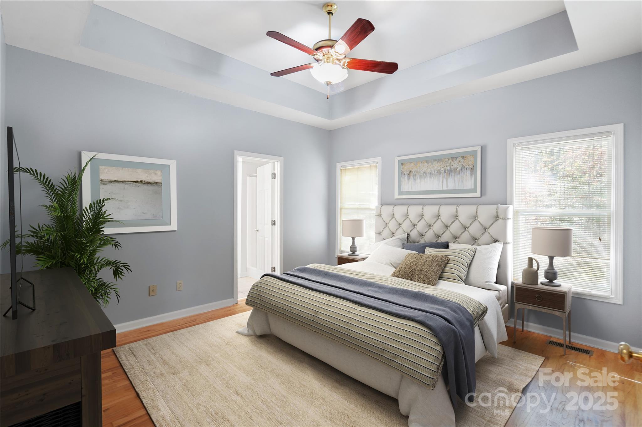 236 Woody Circle Tryon, NC 28782 - Photo 12 of 26 a bedroom with bed and a potted plant