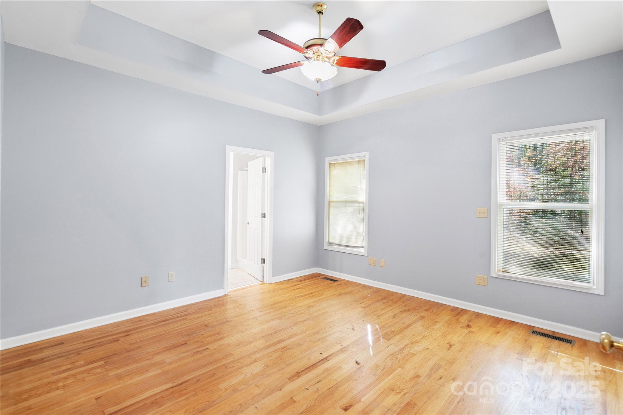 236 Woody Circle Tryon, NC 28782 - Photo 13 of 26 a view of an empty room with window and a chandelier fan