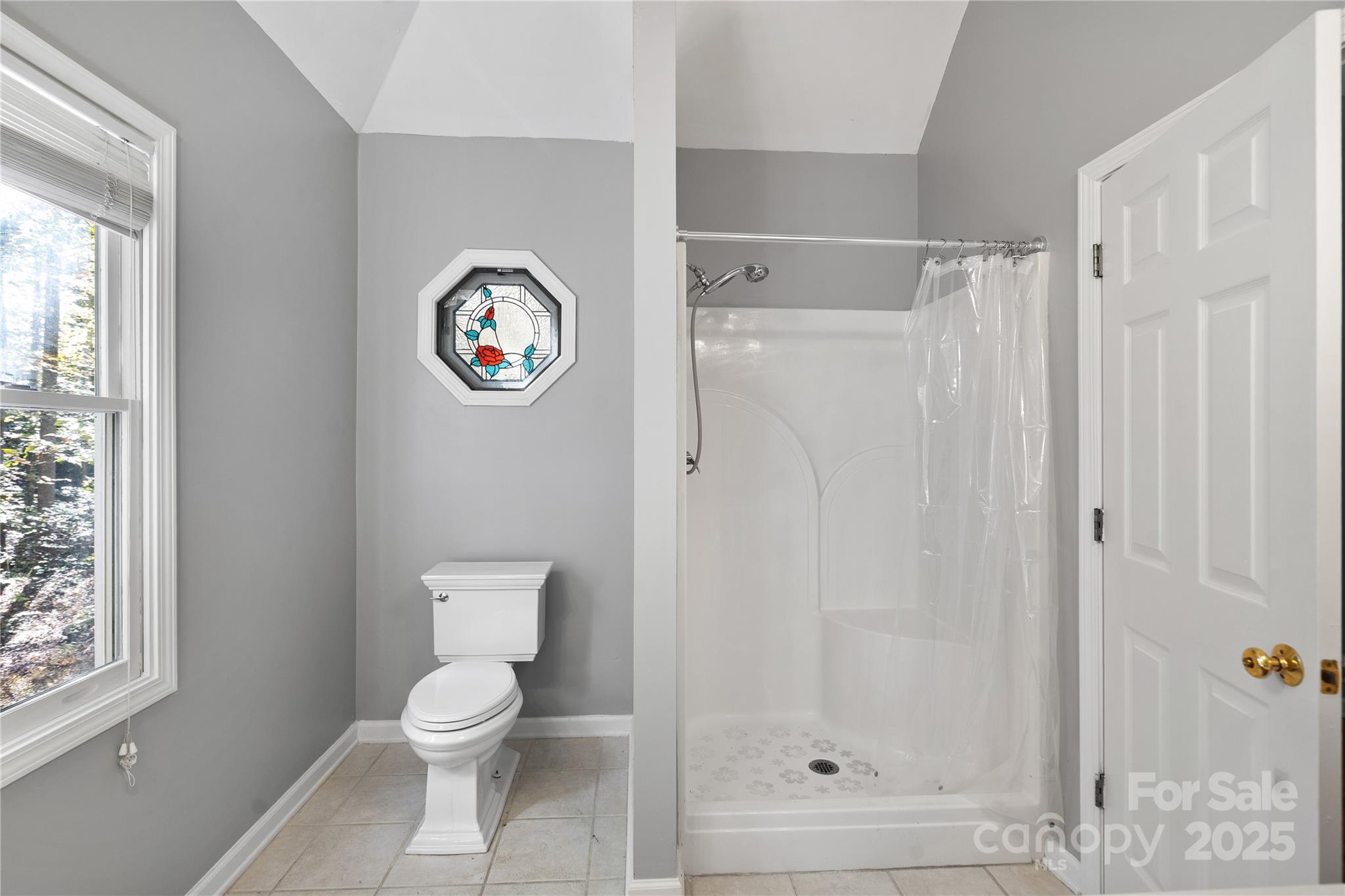 236 Woody Circle Tryon, NC 28782 - Photo 15 of 26 a bathroom with a toilet and a shower