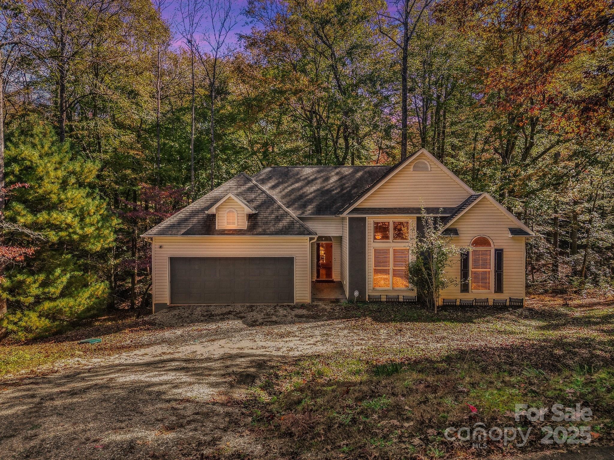 236 Woody Circle Tryon, NC 28782 - Photo 2 of 26 a front view of a house with a yard
