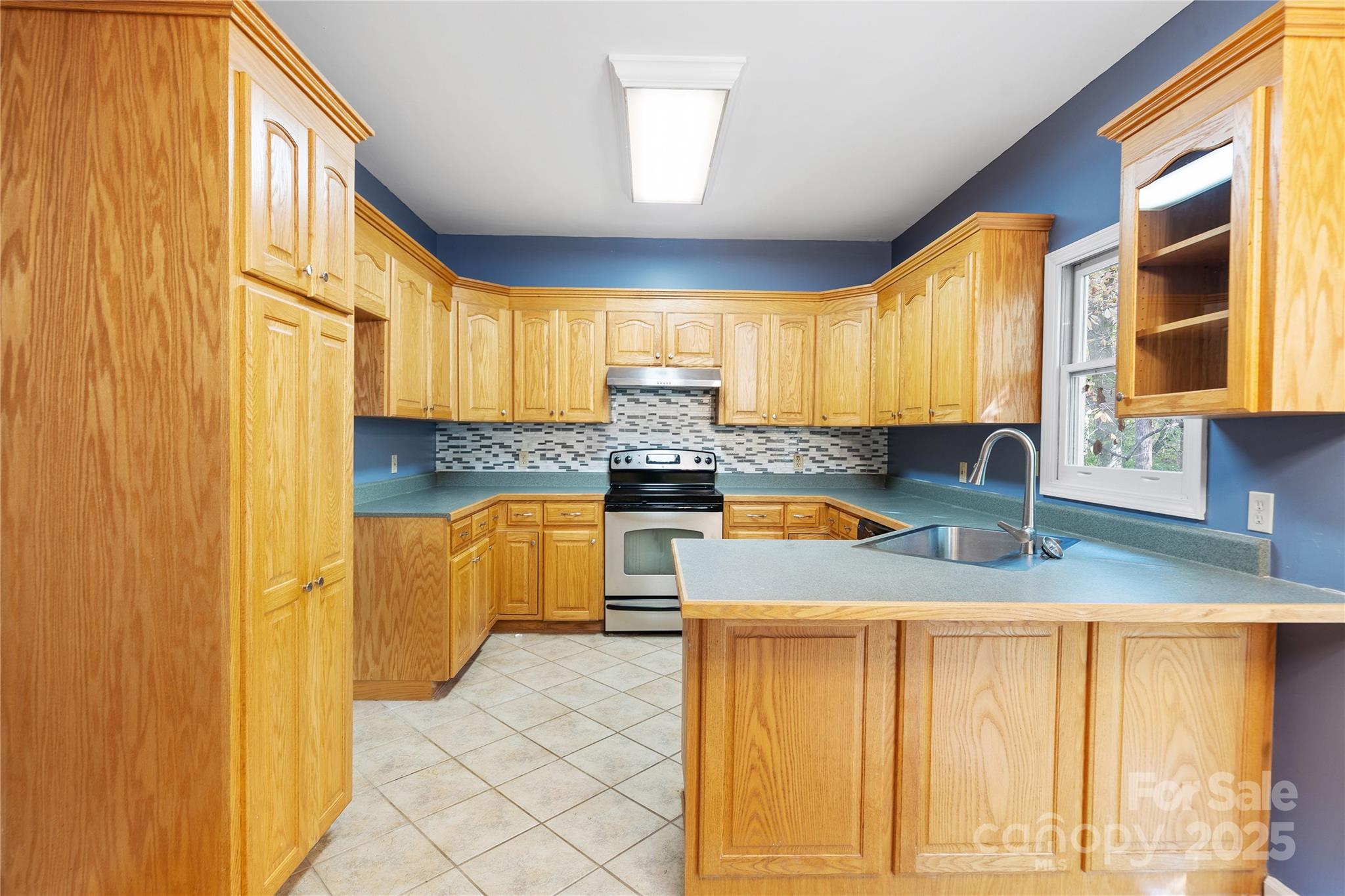 236 Woody Circle Tryon, NC 28782 - Photo 7 of 26 a kitchen with granite countertop a sink and a window