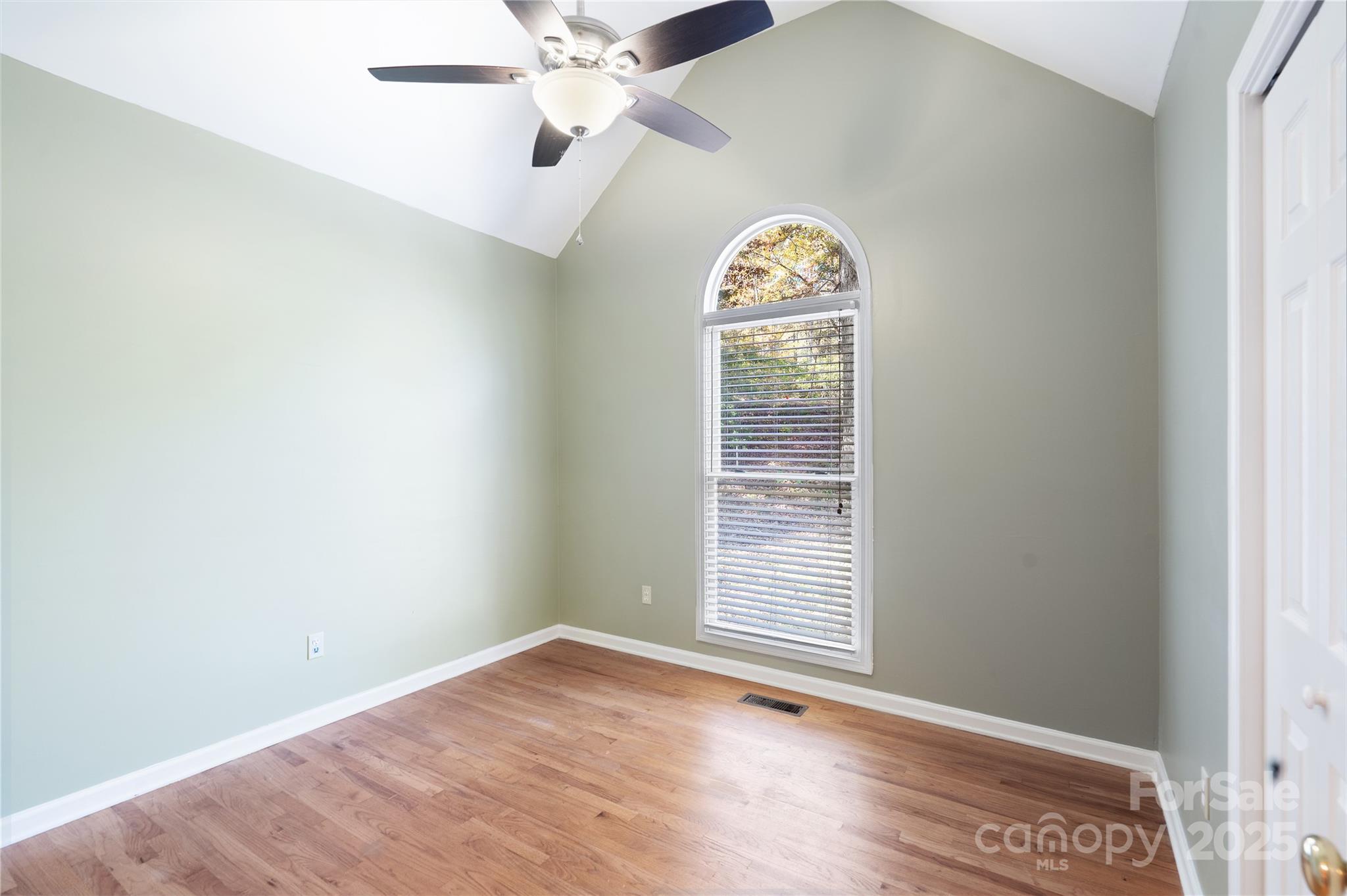 236 Woody Circle Tryon, NC 28782 - Photo 10 of 26 an empty room with windows and fan