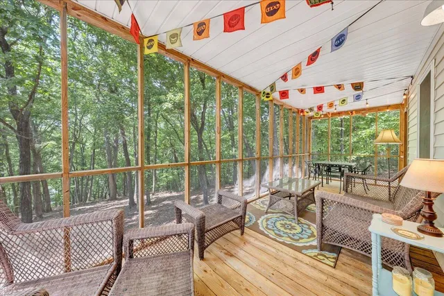 a view of a backyard with large trees