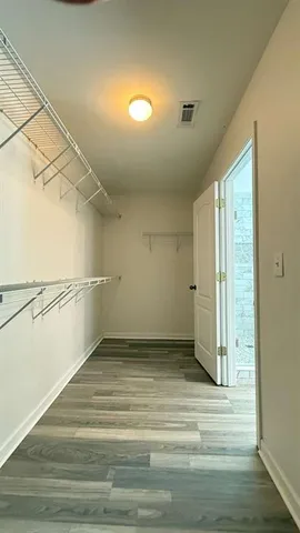 a view of a kitchen with a sink and refrigerator