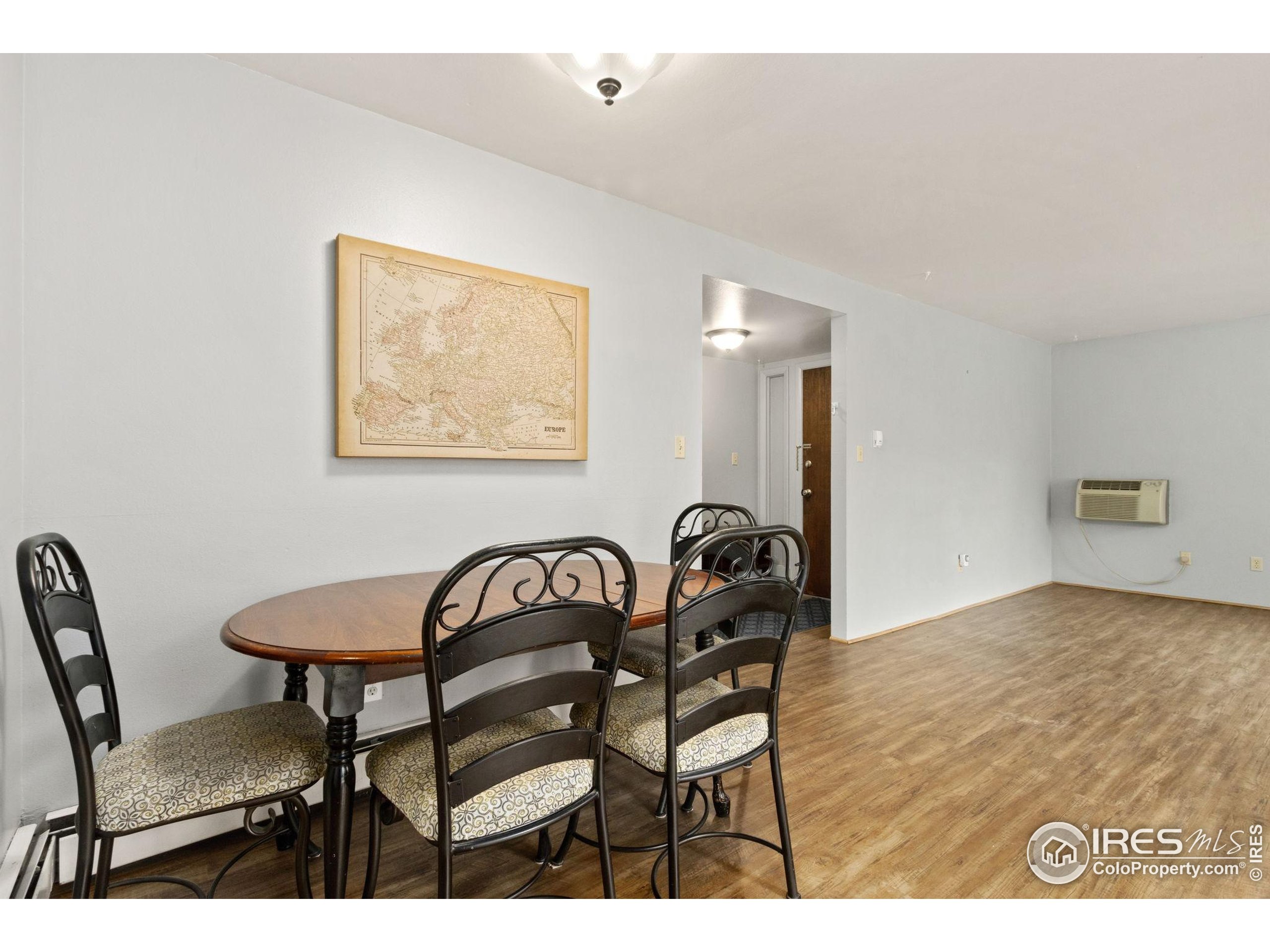 1625 West Elizabeth Street, Unit G2 Fort Collins, CO 80521 - Photo 15 of 45 a view of a room with furniture and wooden floor