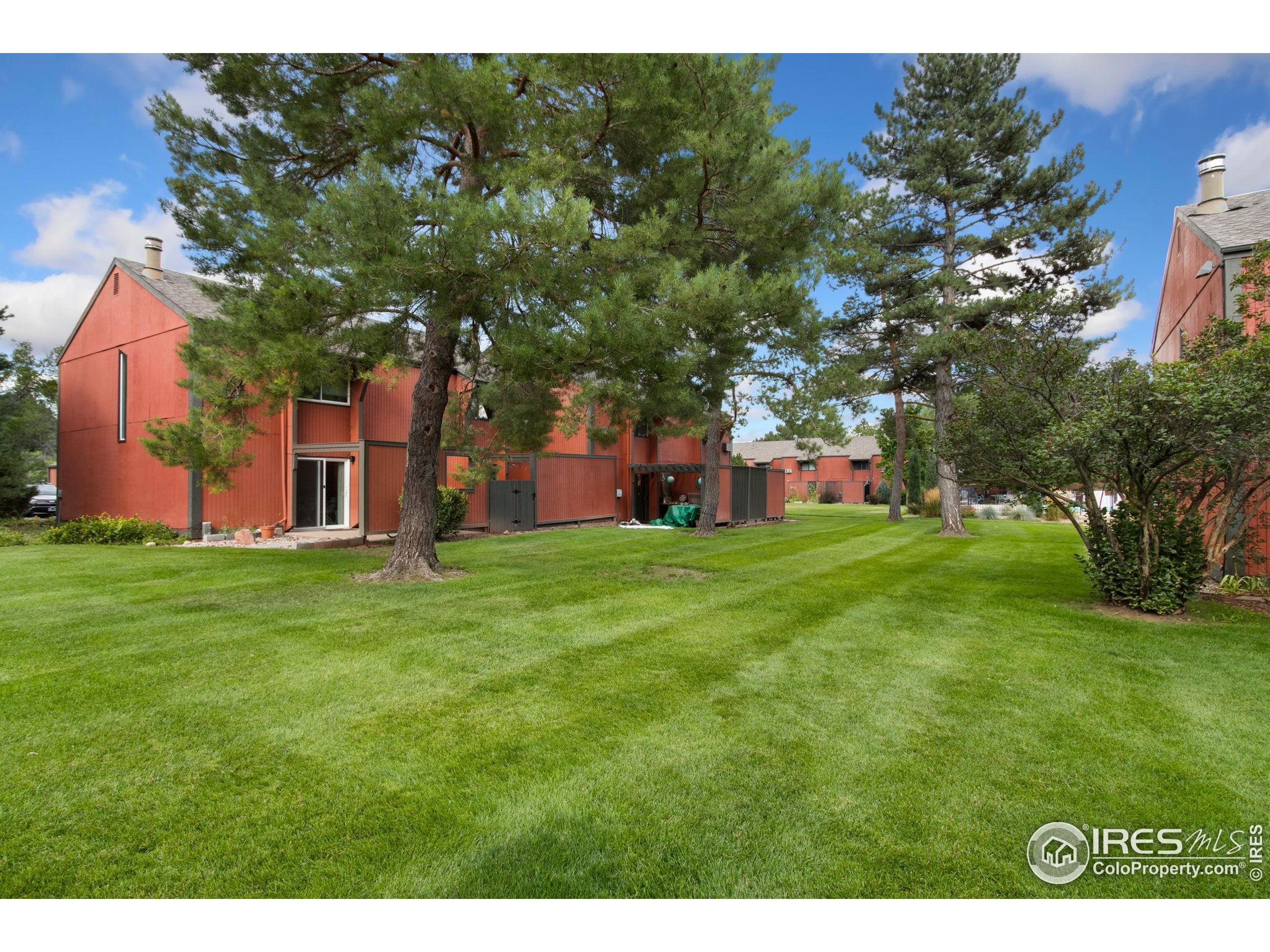 1625 West Elizabeth Street, Unit G2 Fort Collins, CO 80521 - Photo 30 of 45 a backyard of a house with lots of green space