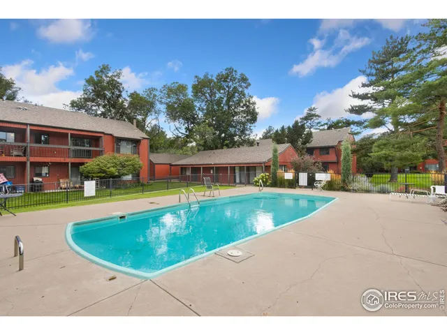 a view of a street with a building in the background