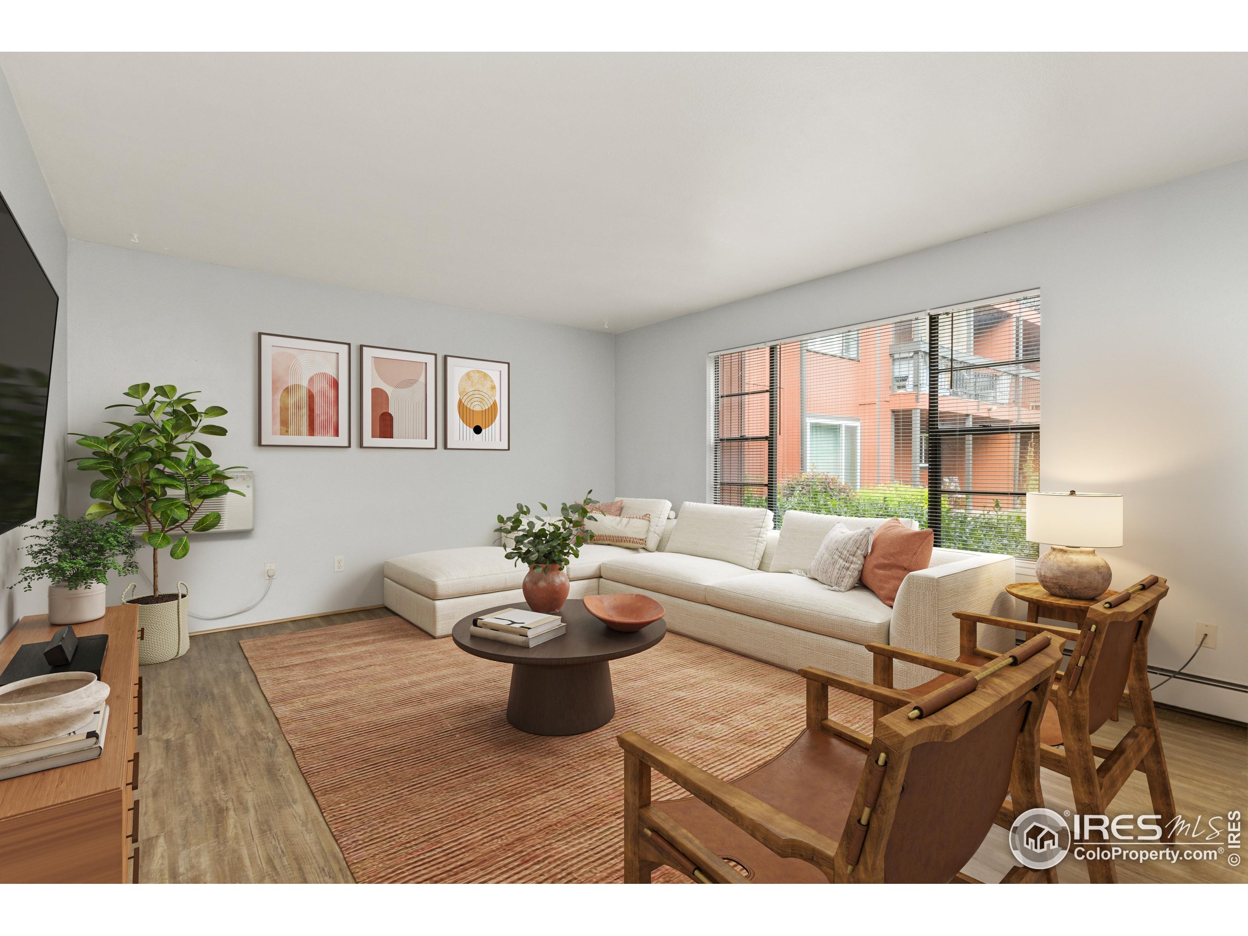 1625 West Elizabeth Street, Unit G2 Fort Collins, CO 80521 - Photo 5 of 45 a living room with furniture and a potted plant