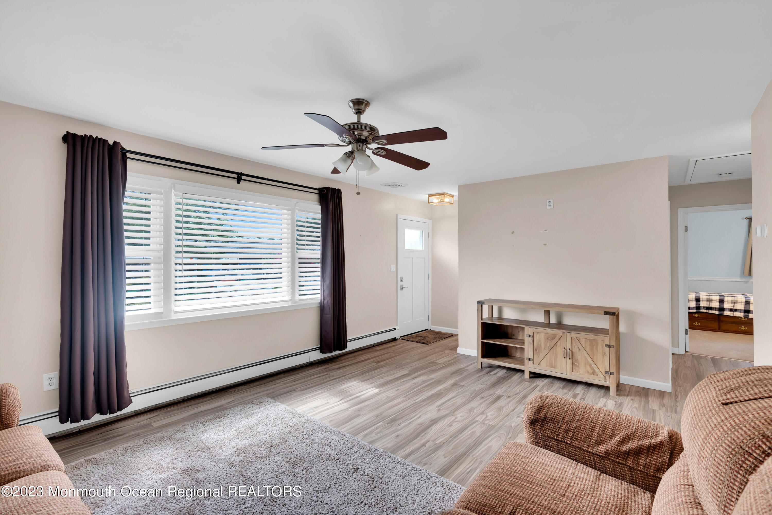 1313 Sleepy Hollow Road Point Pleasant, NJ 08742 - Photo 13 of 34 a living room with furniture and a window
