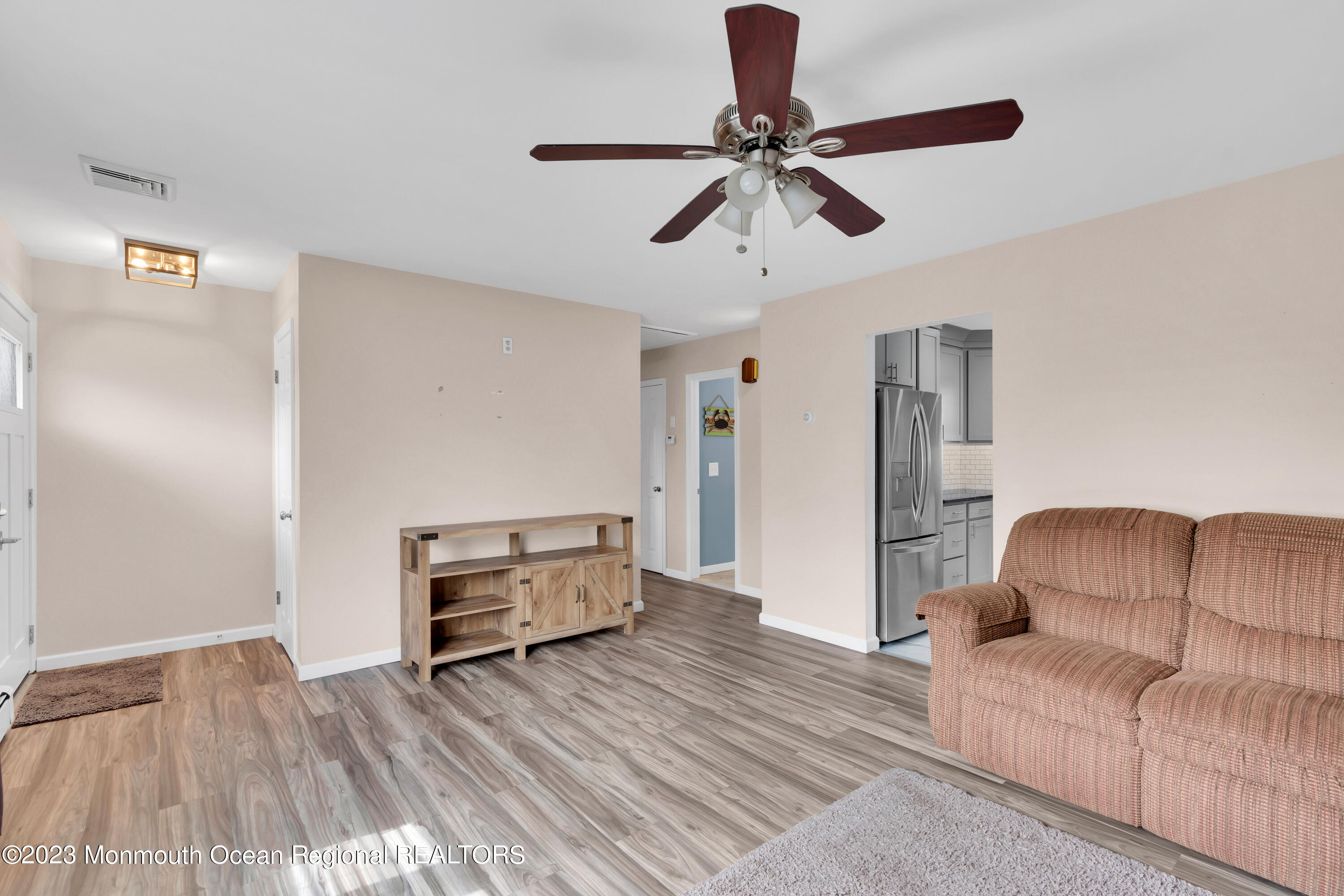 1313 Sleepy Hollow Road Point Pleasant, NJ 08742 - Photo 14 of 34 a living room with furniture and a wooden floor