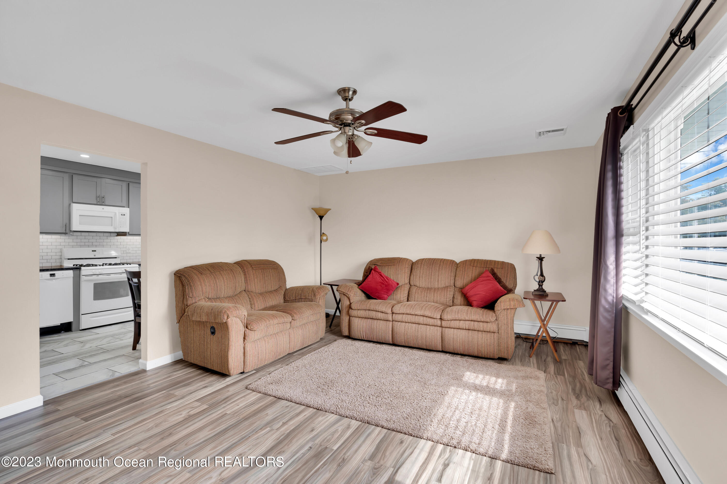 1313 Sleepy Hollow Road Point Pleasant, NJ 08742 - Photo 15 of 34 a living room with furniture and kitchen view