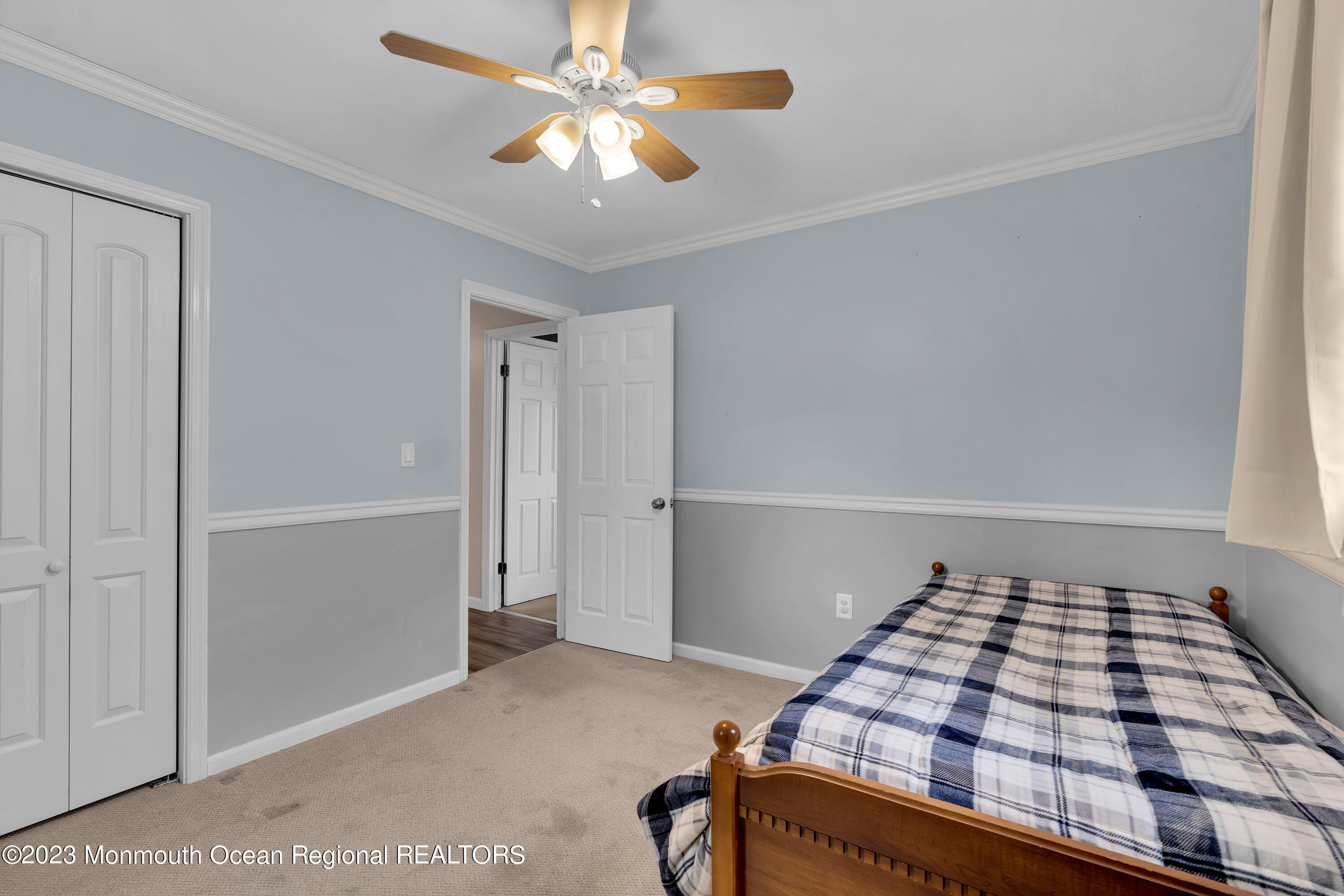1313 Sleepy Hollow Road Point Pleasant, NJ 08742 - Photo 22 of 34 a bedroom with a bed and a ceiling fan