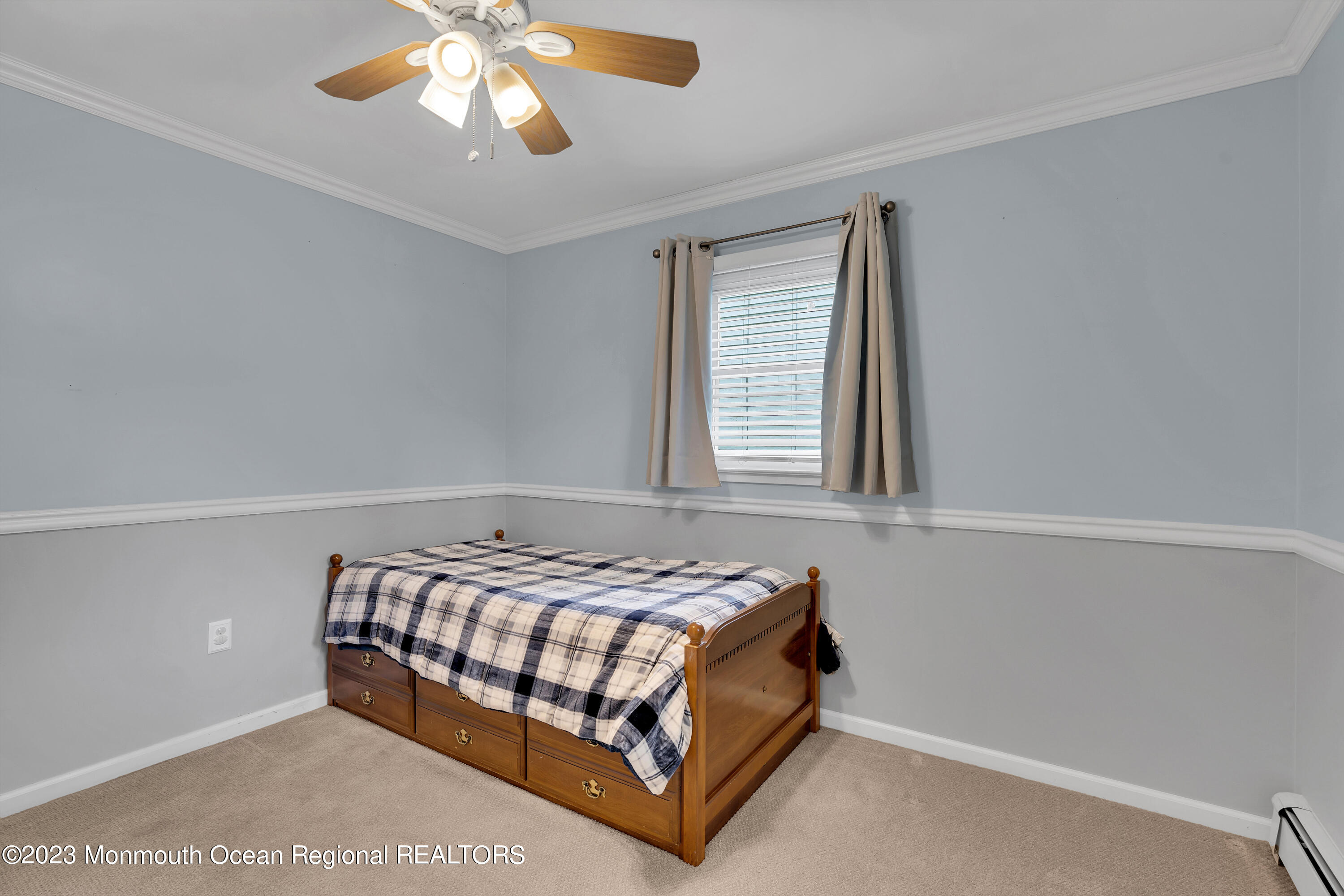 1313 Sleepy Hollow Road Point Pleasant, NJ 08742 - Photo 23 of 34 a bedroom with a bed and window