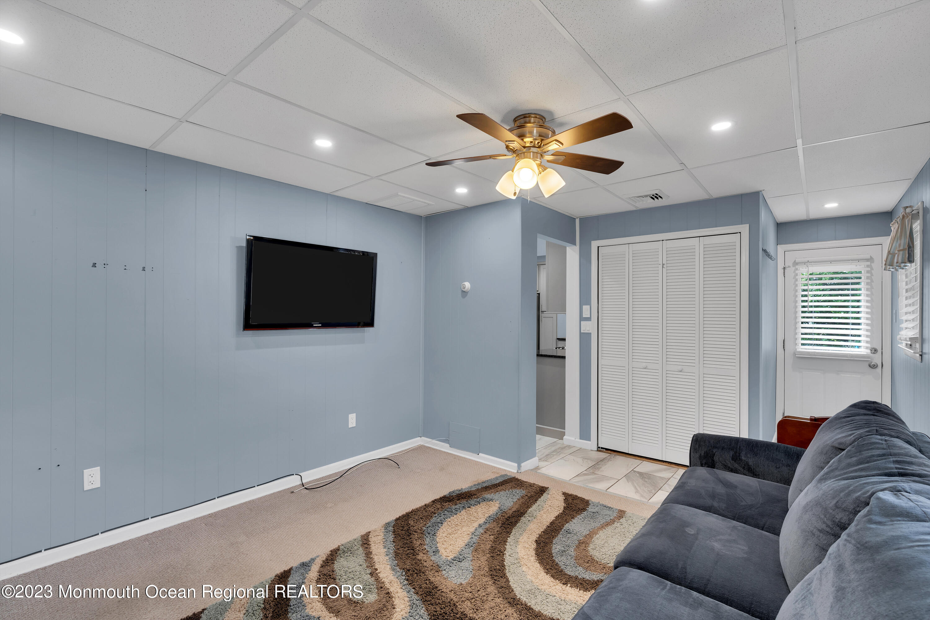 1313 Sleepy Hollow Road Point Pleasant, NJ 08742 - Photo 26 of 34 a bedroom with a bed and a flat screen tv