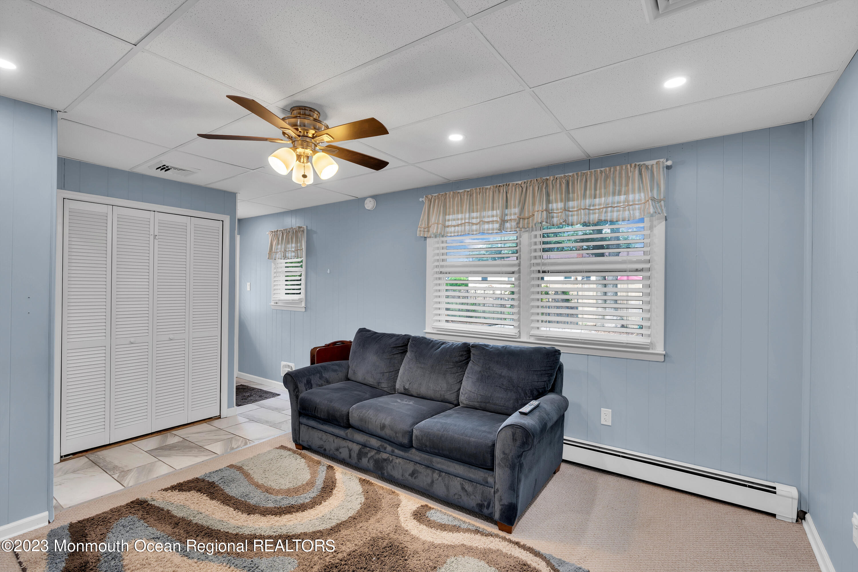 1313 Sleepy Hollow Road Point Pleasant, NJ 08742 - Photo 28 of 34 a living room with furniture and a large window