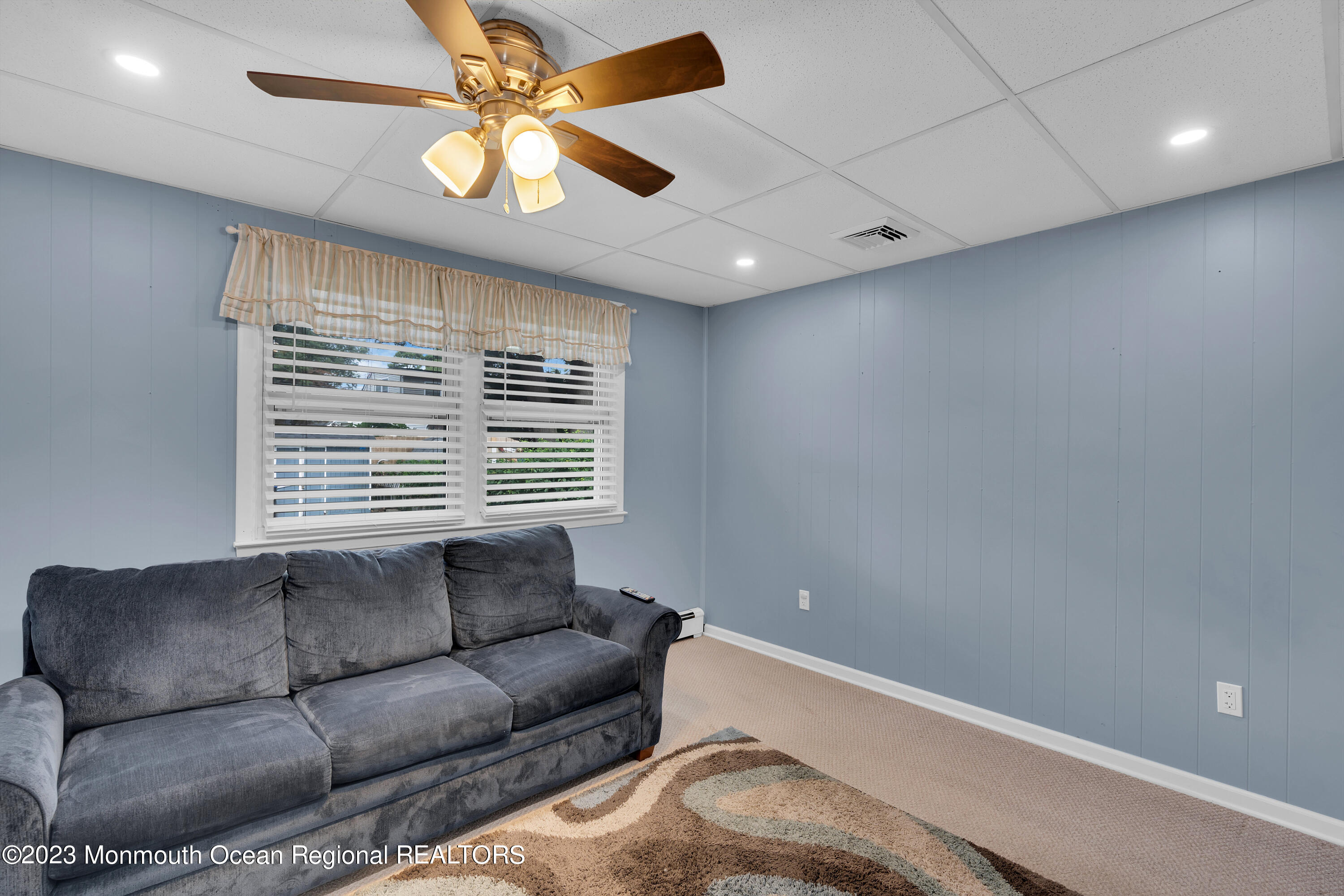 1313 Sleepy Hollow Road Point Pleasant, NJ 08742 - Photo 29 of 34 a living room with furniture and a window