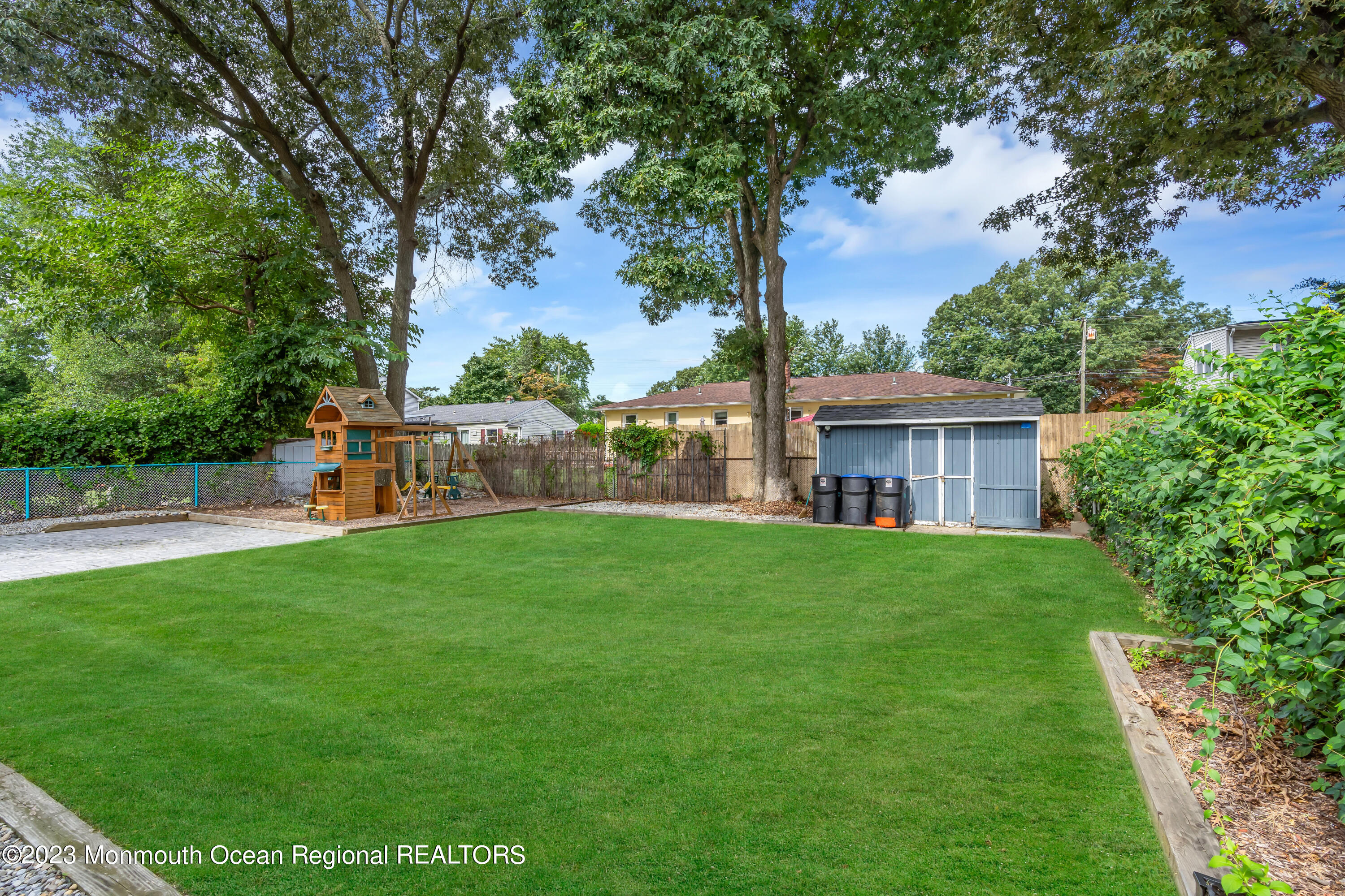 1313 Sleepy Hollow Road Point Pleasant, NJ 08742 - Photo 8 of 34 a view of a house with backyard and a garden