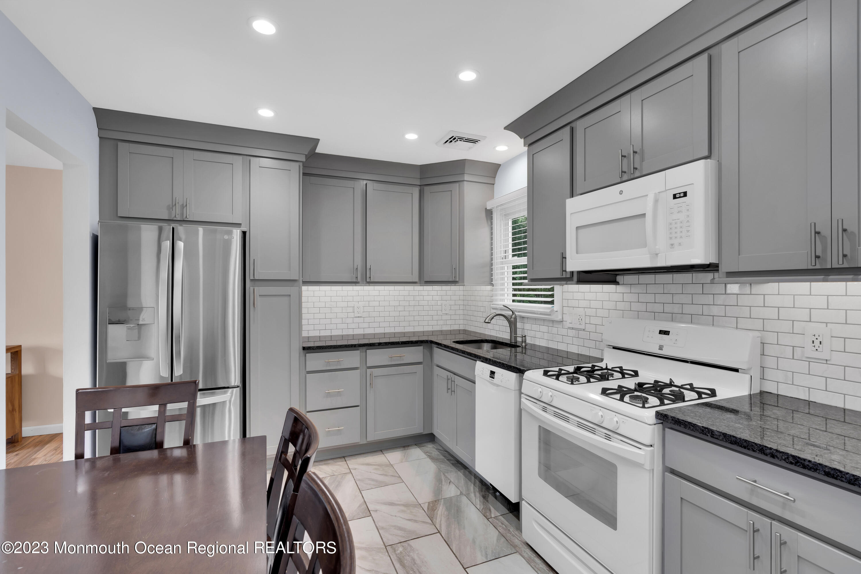 1313 Sleepy Hollow Road Point Pleasant, NJ 08742 - Photo 10 of 34 a kitchen with a sink a stove and cabinets