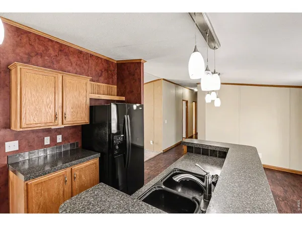 a kitchen with a stove a sink and cabinets