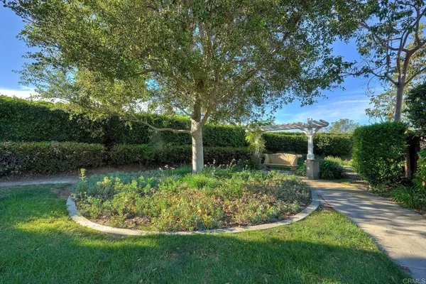 a view of a house with a flower garden